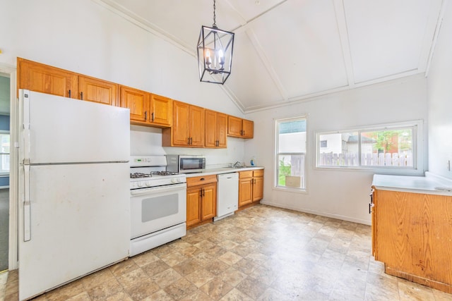 kitchen with light countertops, high vaulted ceiling, hanging light fixtures, and white appliances