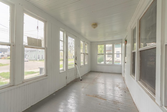 unfurnished sunroom with wood-type flooring
