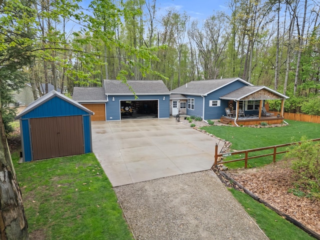 2469 Ash Te Wette Beach Dr, Hillsdale, MI 49242 - view of front of house featuring fence, a front lawn, a porch, an outbuilding, and driveway