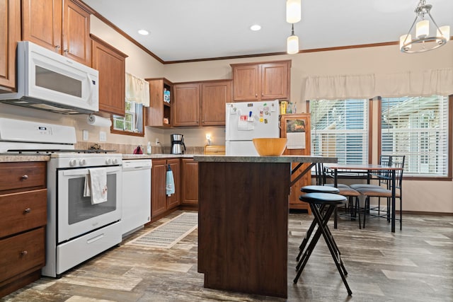 2469 Ash Te Wette Beach Dr, Hillsdale, MI 49242 - kitchen with open shelves, white appliances, wood finished floors, a kitchen island, and ornamental molding