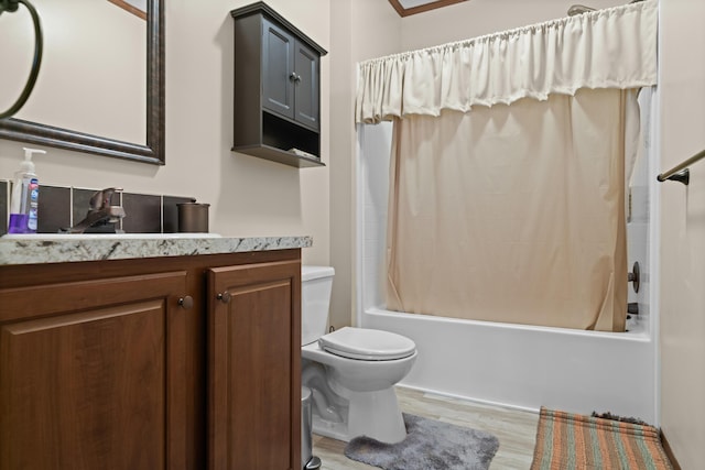 2469 Ash Te Wette Beach Dr, Hillsdale, MI 49242 - bathroom with vanity, shower / bathtub combination with curtain, wood finished floors, and toilet