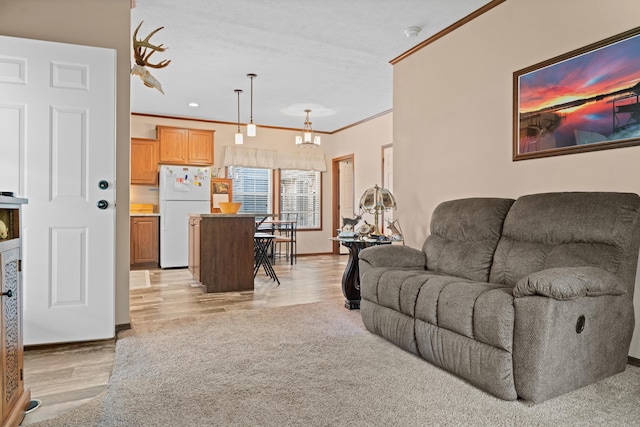 2469 Ash Te Wette Beach Dr, Hillsdale, MI 49242 - living area with an inviting chandelier, baseboards, ornamental molding, and light wood finished floors