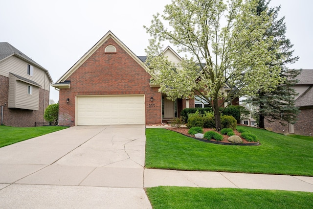 6175 Foxfire Cir, Clarkston, MI 48346 - view of front facade with brick siding, concrete driveway, and a front yard