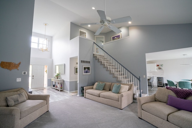6175 Foxfire Cir, Clarkston, MI 48346 - living area with a towering ceiling, a ceiling fan, stairway, recessed lighting, and a chandelier