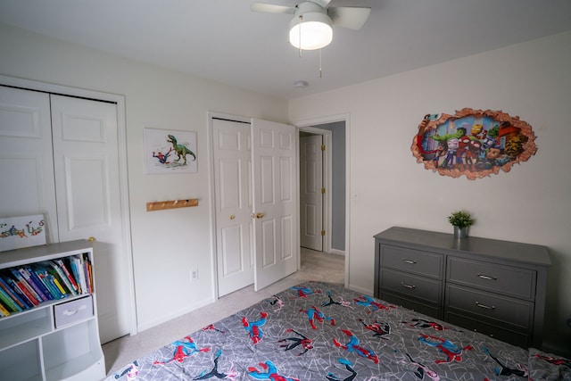 6175 Foxfire Cir, Clarkston, MI 48346 - bedroom with carpet flooring, ceiling fan, baseboards, and multiple closets