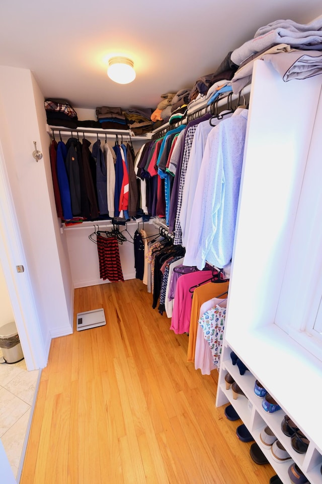 spacious closet with wood finished floors