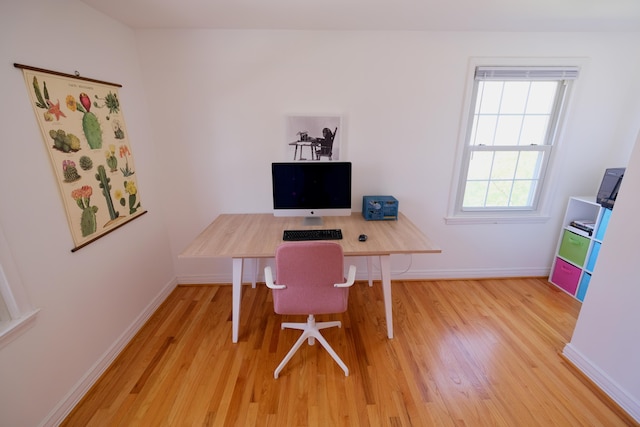 office with baseboards and wood finished floors
