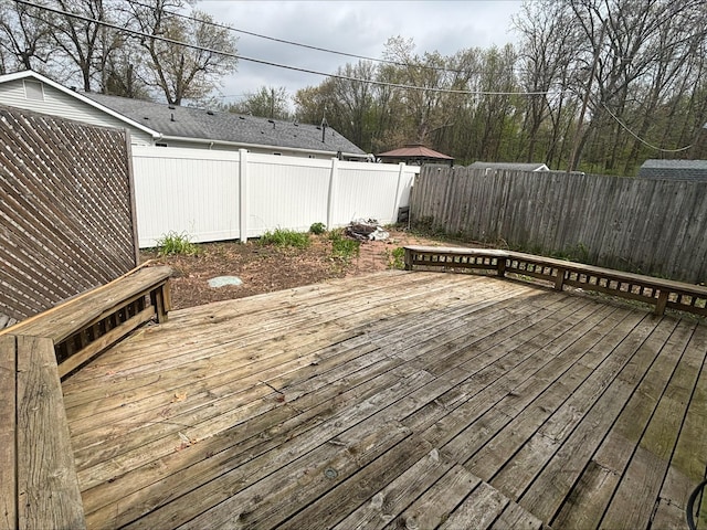 deck with a fenced backyard