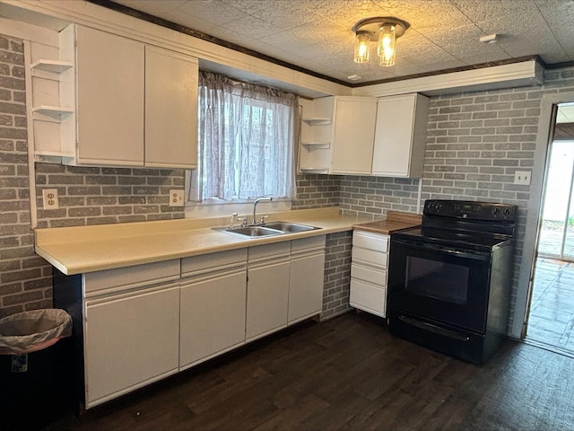 kitchen featuring a healthy amount of sunlight, black electric range oven, open shelves, a sink, and white cabinetry