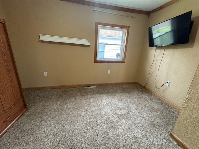 interior space featuring baseboards and carpet