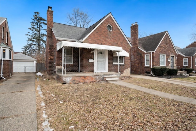 5534 Oldtown St, Detroit, MI 48224 - bungalow with brick siding, an outdoor structure, a chimney, and a detached garage