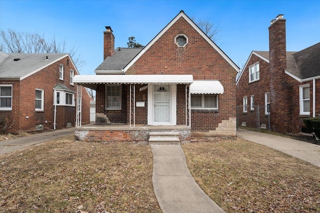 5534 Oldtown St, Detroit, MI 48224 - bungalow-style house featuring a porch, a chimney, and brick siding