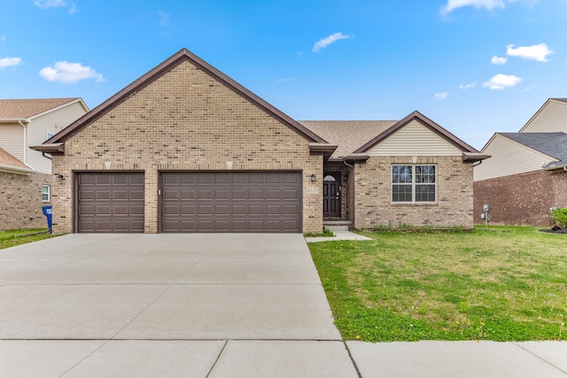 ranch-style home with an attached garage, brick siding, driveway, and a front yard