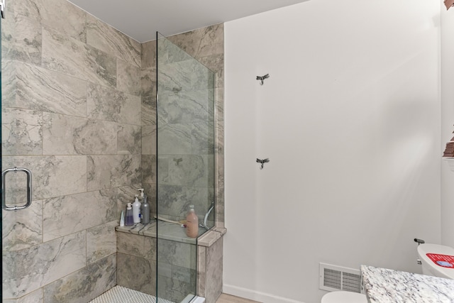 full bath featuring a shower stall and visible vents