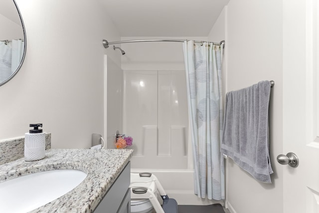 full bathroom featuring shower / bathtub combination with curtain and vanity