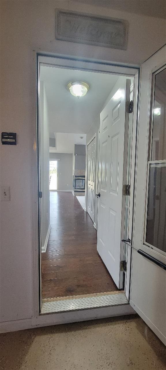 corridor featuring baseboards