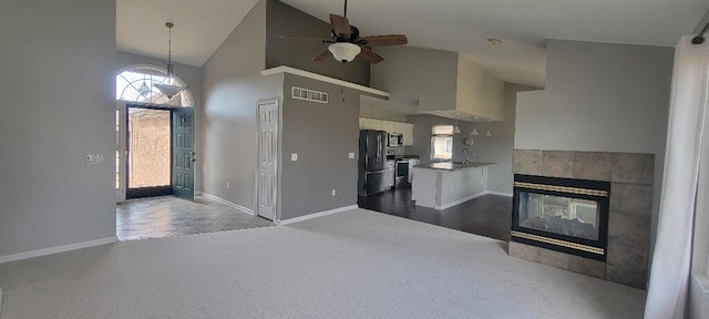 kitchen featuring plenty of natural light, a ceiling fan, stainless steel appliances, and visible vents
