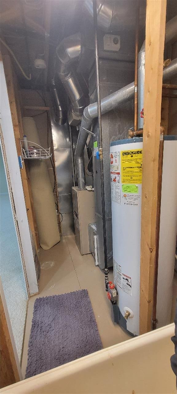 utility room with water heater