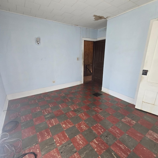 empty room with tile patterned floors and visible vents
