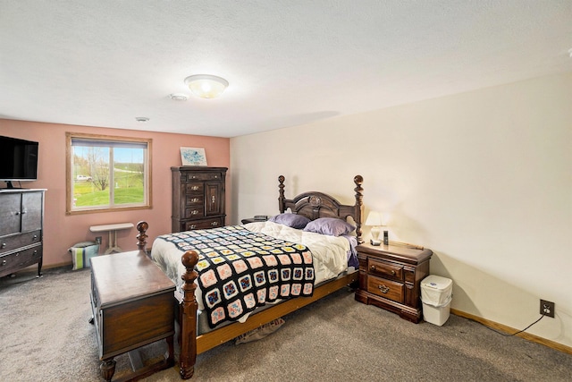 carpeted bedroom featuring baseboards