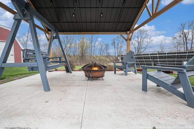 view of patio / terrace featuring an outdoor fire pit