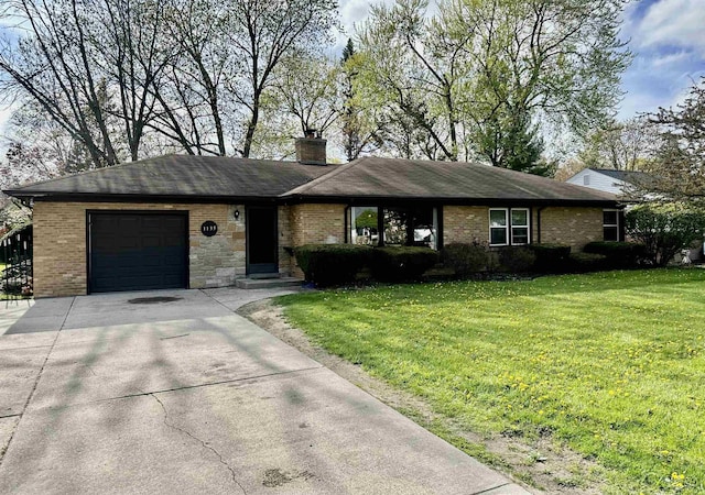 ranch-style house featuring an attached garage, driveway, a front lawn, and brick siding