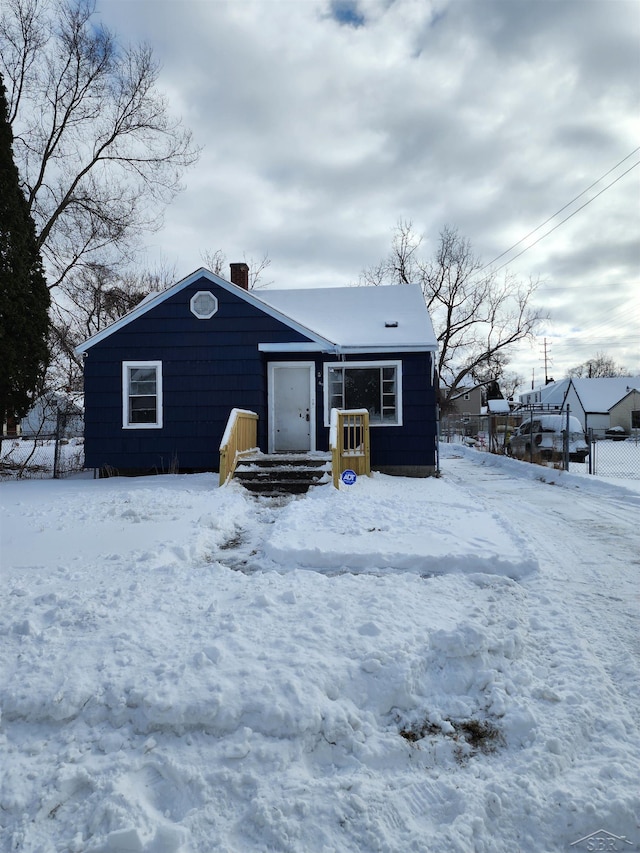 view of front of property featuring a chimney