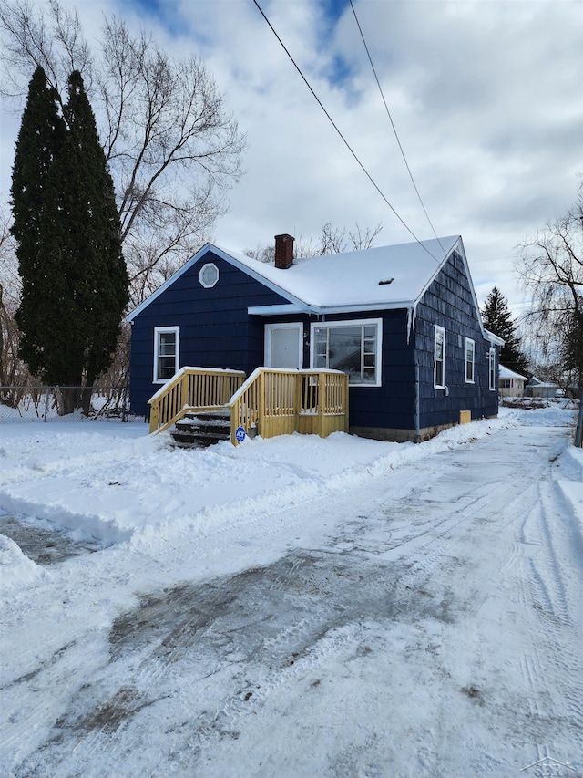view of front of house with a chimney