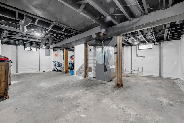 19631 Dwyer St, Detroit, MI 48234 - basement with heating unit, stairs, and electric panel
