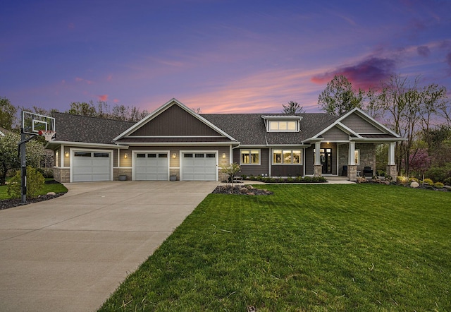 craftsman-style house featuring a lawn, concrete driveway, an attached garage, a shingled roof, and stone siding