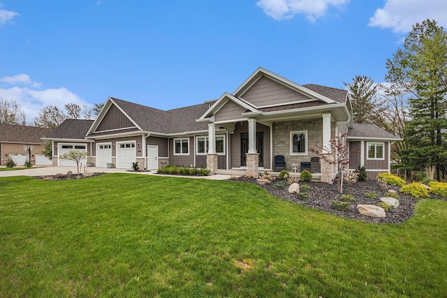 craftsman house featuring an attached garage, a front lawn, stone siding, and concrete driveway