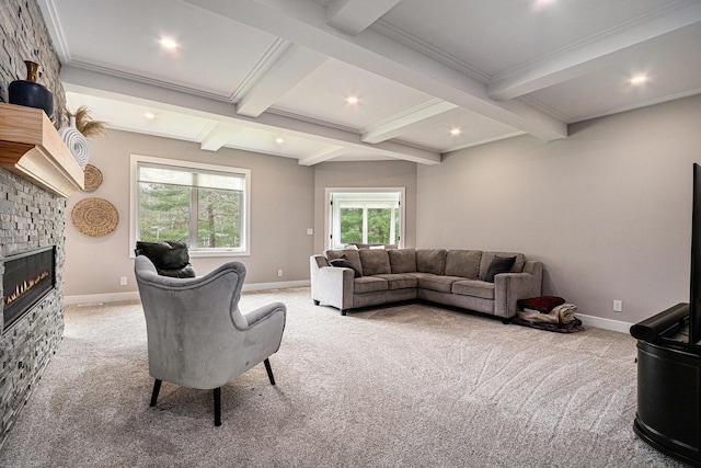 living area featuring baseboards, beam ceiling, and light colored carpet