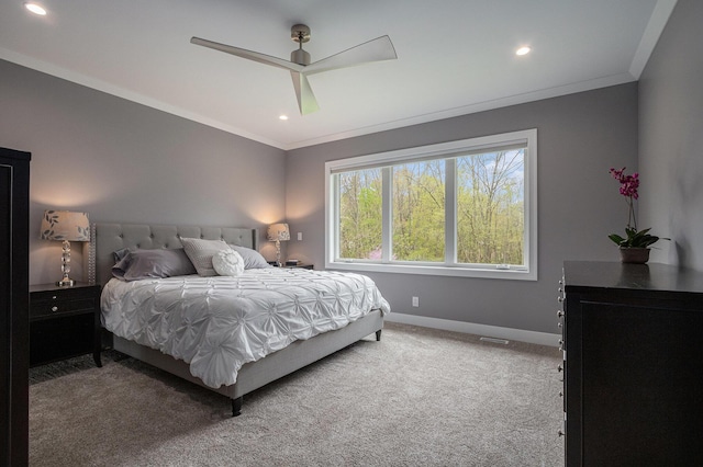 carpeted bedroom with crown molding, recessed lighting, baseboards, and a ceiling fan