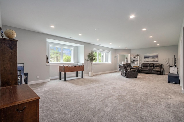 carpeted living room featuring recessed lighting and baseboards