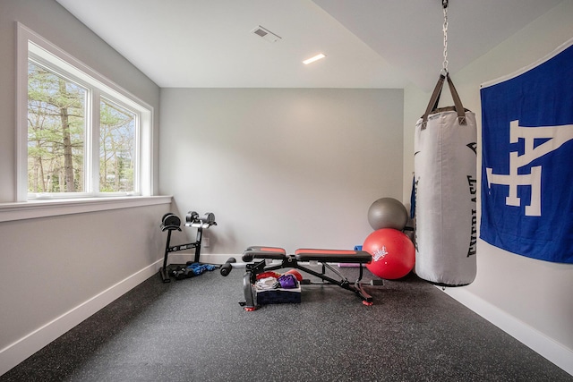 exercise area featuring visible vents and baseboards