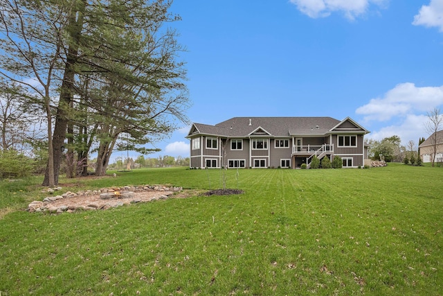 back of property featuring a lawn