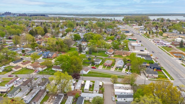 aerial overview of property's location featuring a large body of water and nearby suburban area