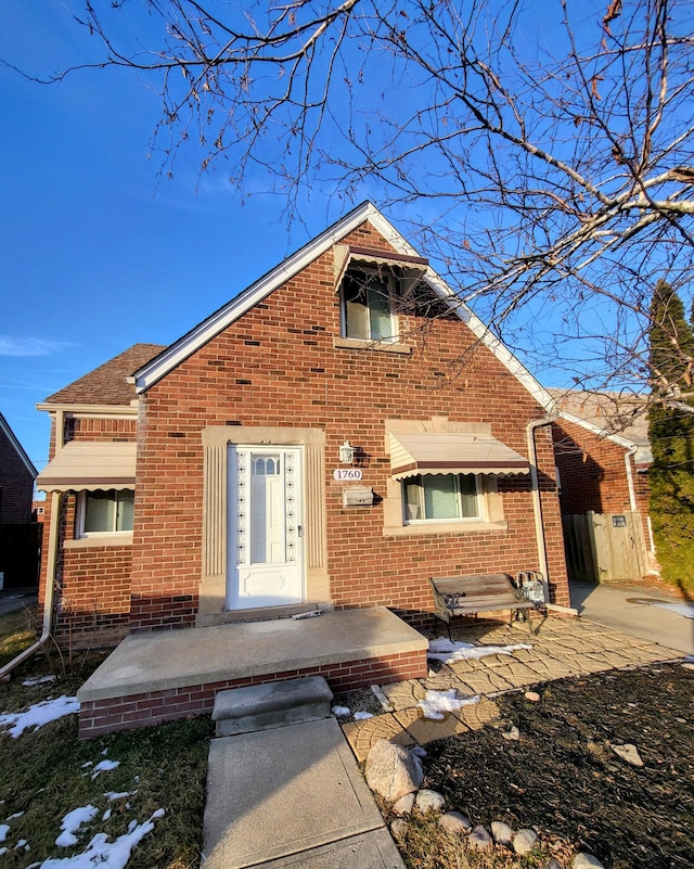 view of front of home featuring brick siding