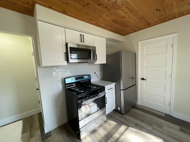 kitchen featuring baseboards, light wood-type flooring, white cabinetry, wood ceiling, and stainless steel appliances