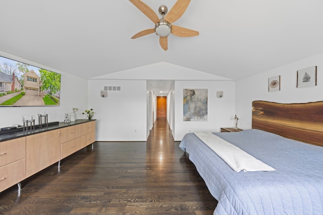 bedroom featuring lofted ceiling, dark wood-style flooring, and a ceiling fan