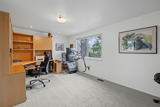 office space with light colored carpet and baseboards