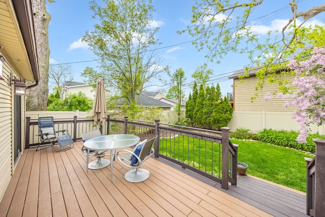 wooden terrace with outdoor dining space
