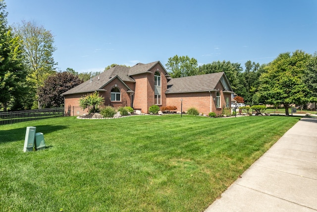 53345 Williams Way, Shelby Twp, MI 48316 - view of front facade featuring brick siding, fence, and a front yard
