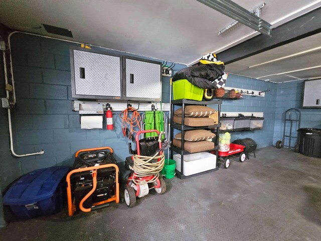 garage featuring concrete block wall
