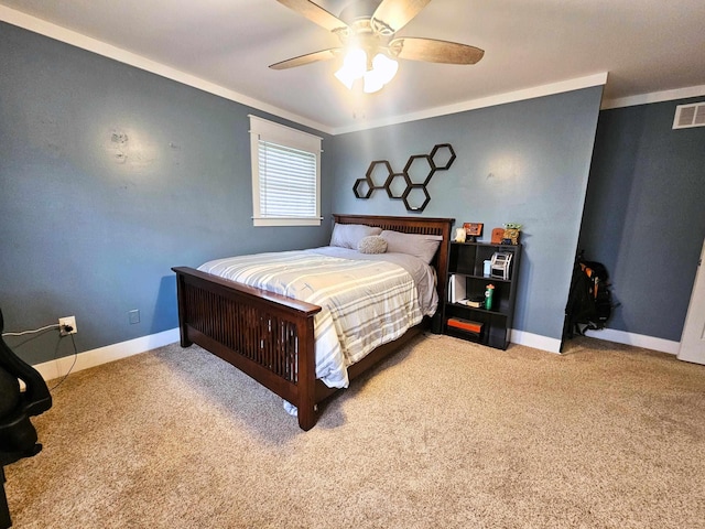 bedroom with crown molding, carpet flooring, baseboards, and a ceiling fan