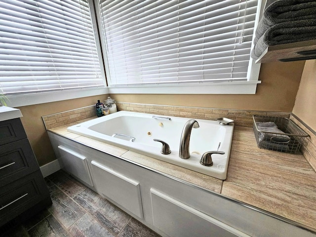 full bath with a jetted tub