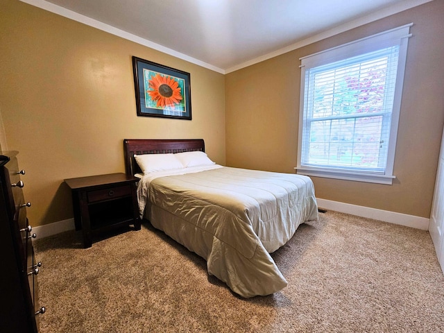 bedroom with baseboards, ornamental molding, and carpet