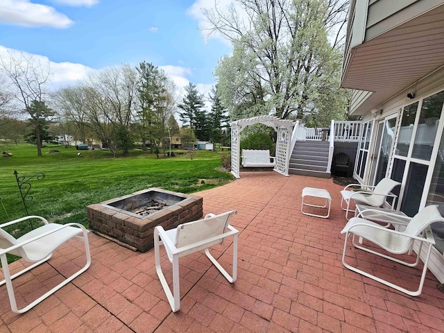 view of patio with an outdoor fire pit