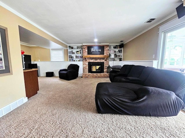 carpeted living room featuring visible vents, a brick fireplace, and plenty of natural light