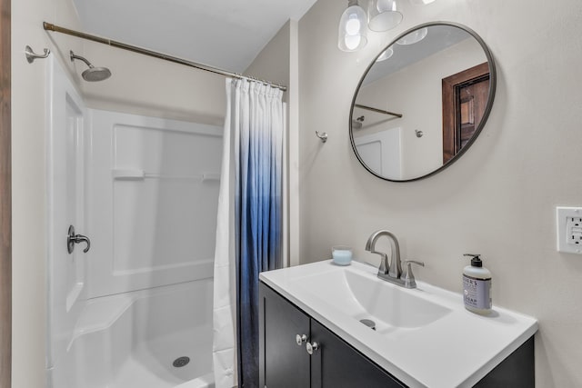 full bathroom with a shower with shower curtain and vanity